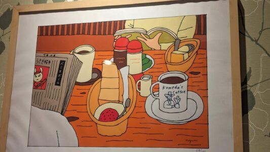 Tableau représentant l'intérieur d'un café Komeda's à Osaka, avec des boissons et des plats japonais