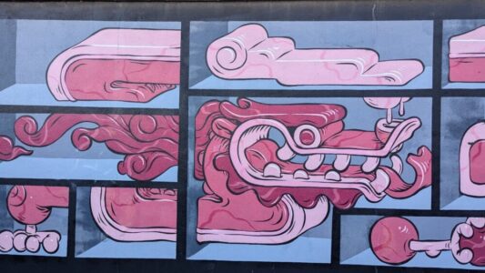 Un street art à Wellington représentant un dragon rose dans un style pop vibrant. L'œuvre colorée apporte une touche dynamique à l'architecture urbaine de la ville